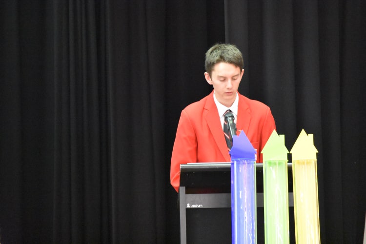 Highschool student in blazer public speaking